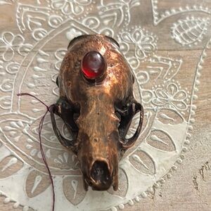 Unique Copper Plated Skunk Skull Shelf Specimen with Red Carnelian.